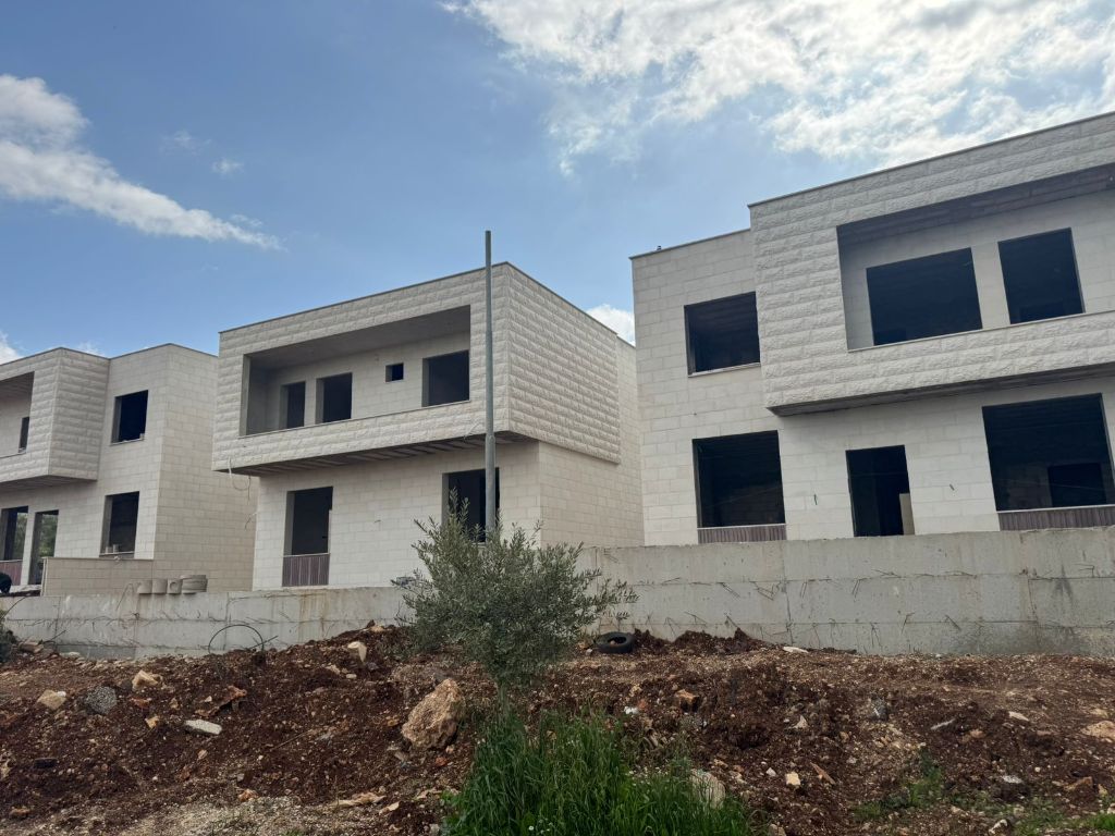 Construction site photograph of modern villas